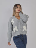 CARDIGAN CON FIOCCHI