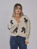 CARDIGAN CON FIOCCHI