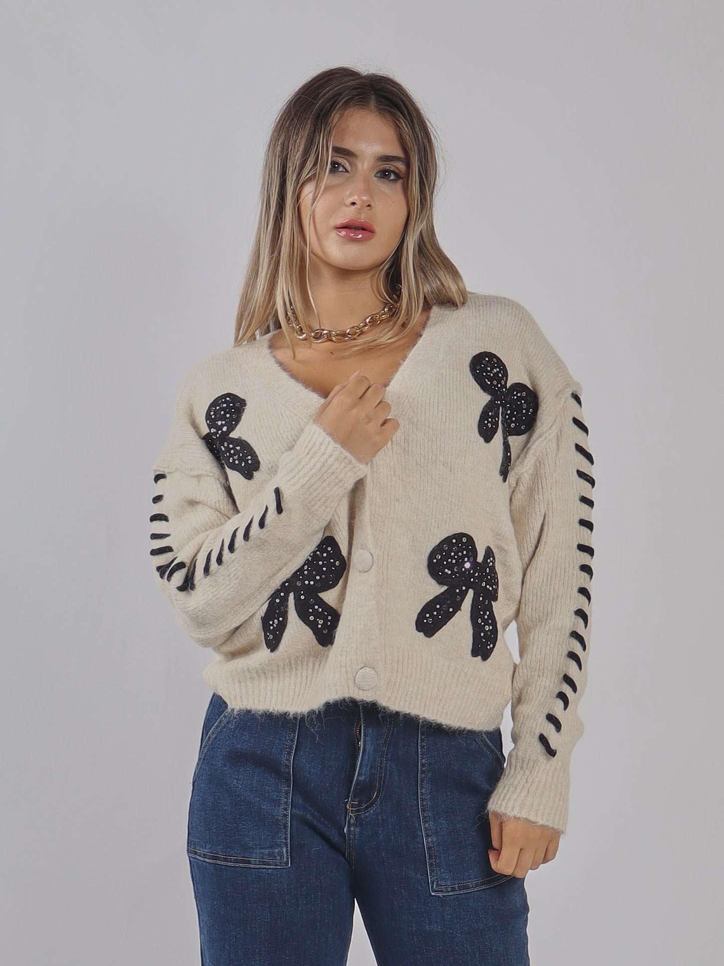 CARDIGAN CON FIOCCHI